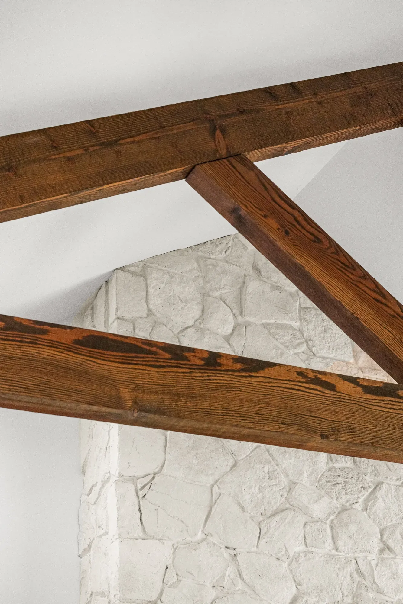 Reclaimed timber and stone detailing inside an Atwell Built home